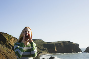 Image showing Woman Yelling On Cliff