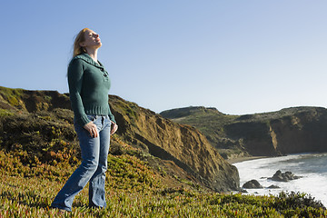 Image showing Woman Standing on Cliffside