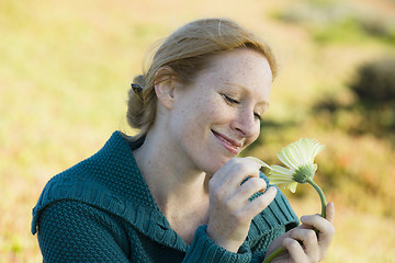 Image showing Woman Outside with Flower