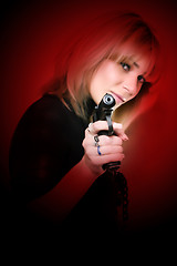 Image showing beautiful girl to keep in hand pistol 