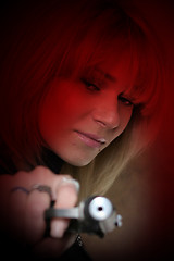 Image showing beautiful girl with pistol at hand