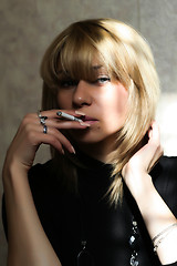 Image showing portrait beautiful girl smokes cigarette 