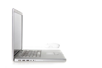 Image showing Sideways View of a Laptop Computer and Mouse
