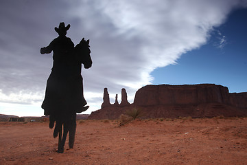 Image showing Three Sisters Monument With Cowboy Silhouette