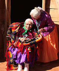 Image showing Navajo Family of 2 Women in Front of Traditional Hogan