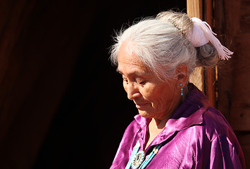 Image showing A Navajo Woman Looking Down Outdoors in Bright Sun