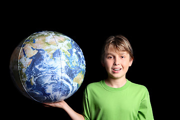 Image showing Boy holding the world earth ball in his hand