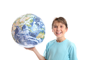 Image showing Smiling boy with world in palm of his hands