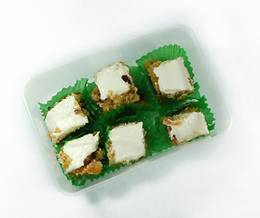 Image showing six mini carrot cakes topped with icing