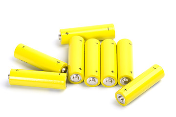 Image showing eight yellow alkaline batteries