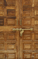 Image showing Old wooden door with a massive brass lock, Indian handicraft