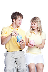 Image showing Young couple saving money