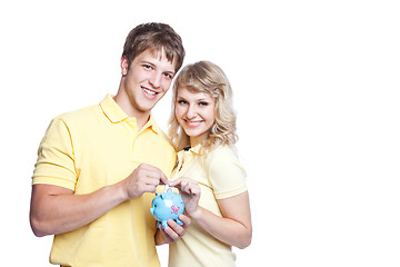 Image showing Young couple saving money