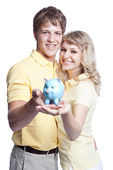 Image showing Young couple saving money