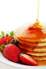 Image showing Syrup Pouring on Pancakes