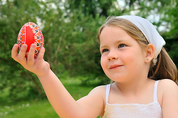 Image showing Little girl holding Easter egg