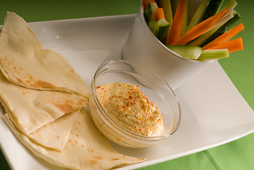 Image showing hummus dip with pita bread and vegetable