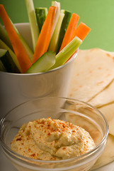 Image showing hummus dip with pita bread and vegetable