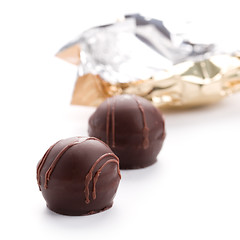 Image showing two foil opened sweets