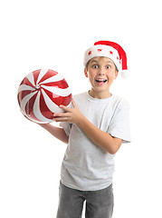 Image showing Child boy holding Christmas bauble decoration
