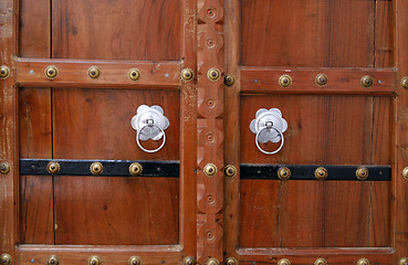 Image showing Beautiful wooden door with silver handles. Pushkar, India