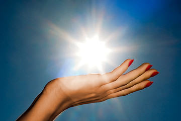 Image showing hand and sun