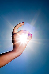 Image showing hand and sun