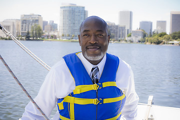 Image showing Man in Life Vest on Sailboat