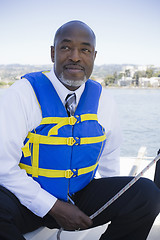 Image showing Man in Life Vest on Sailboat