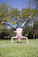 Image showing Tween Girl doing Headstand