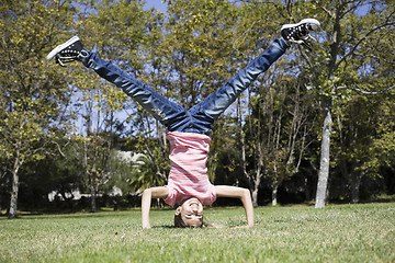 Image showing  Tween Girl Doing Headstand