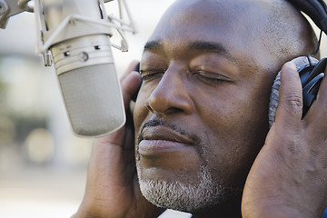 Image showing Man in Front of Microphone