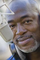 Image showing Man with Microphone and Headphones