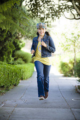 Image showing Tween Girl Running On Sidewalk