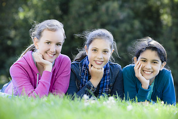 Image showing Group Of Tween Girls Lying On Grass