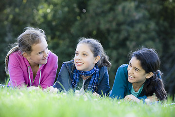 Image showing Group Of Tween Girls Lying On Grass