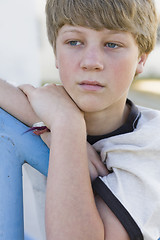 Image showing Boy Leaning on Railing