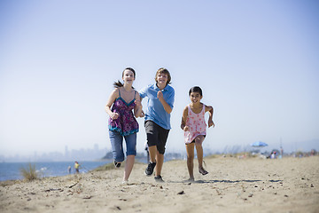 Image showing Three Kids Running on Beach