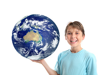 Image showing Smiling child holding our world planet showing Australia Oceania