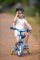 Image showing pretty thai-indian girl on her bike