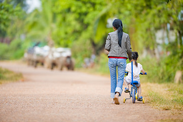 Image showing mother and daughter on the road