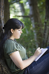 Image showing Young Woman Writing in Journal