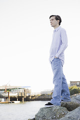 Image showing Teenage Boy Looking at Ocean