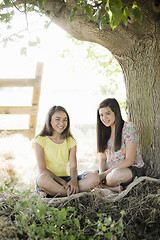 Image showing Two Girls Under a Tree