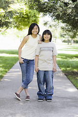 Image showing Asian Brother and Sister Smiling To Camera