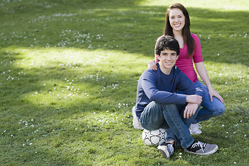 Image showing Two Smiling Teenagers  with Soccer Ball