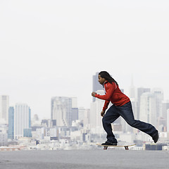 Image showing Teenage Boy on Skateboard