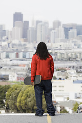 Image showing Teen Boy Holding Skateboard 