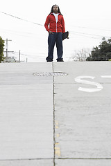 Image showing Teen Boy Standing with Skateboard