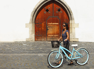 Image showing Woman With A Bicycle In A City